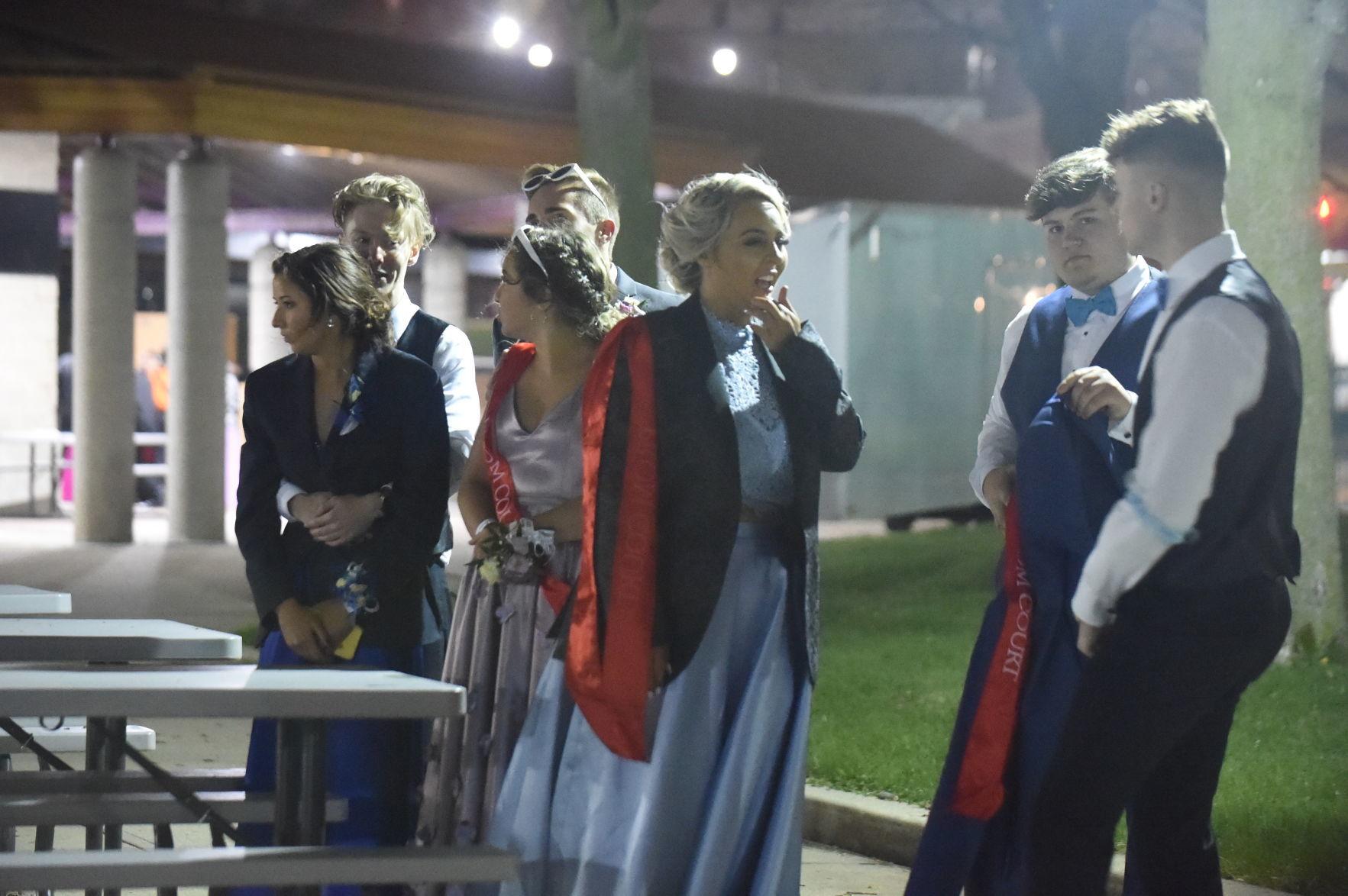 Promgoers keep warm under the fireworks